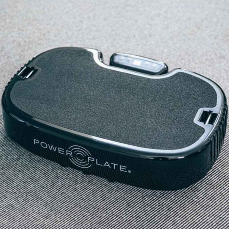 Black Power Plate device on a textured surface