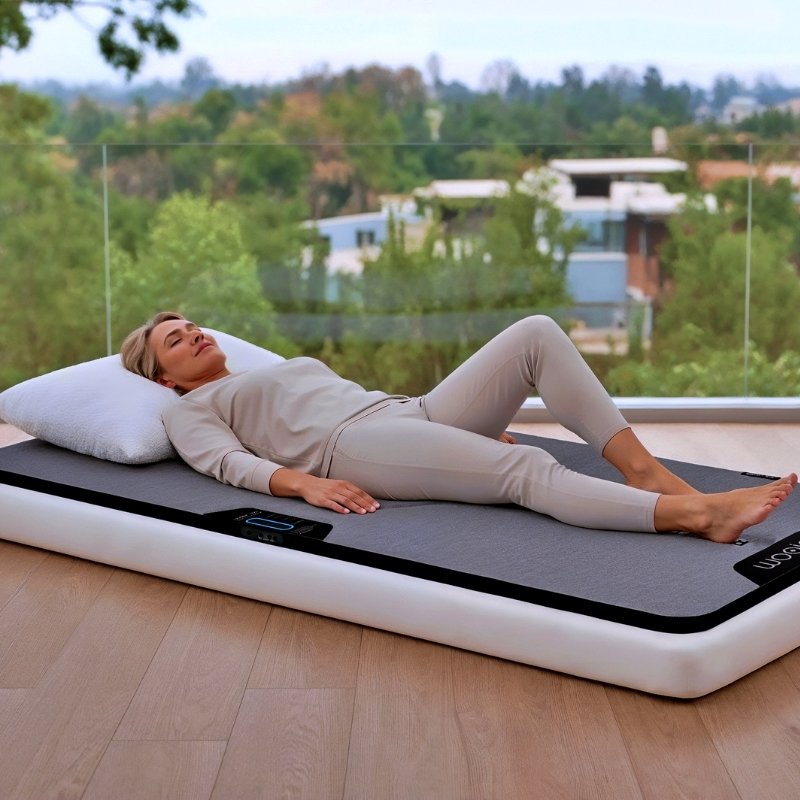 Woman lying on a Woojer MAT