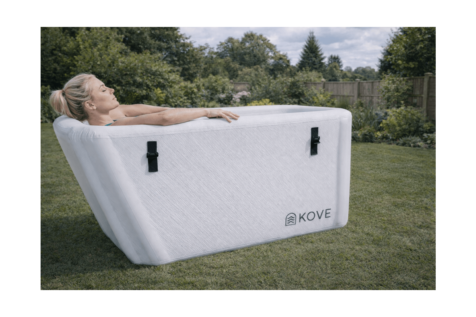 Inflatable hot tub with Kove branding on a grassy outdoor area