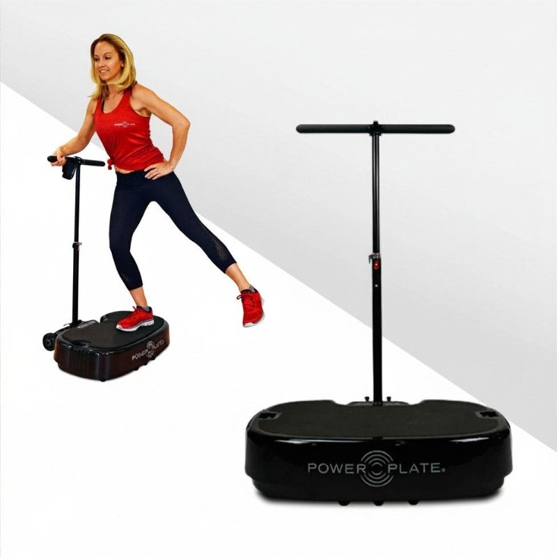 Woman using a Power Plate device with a white background