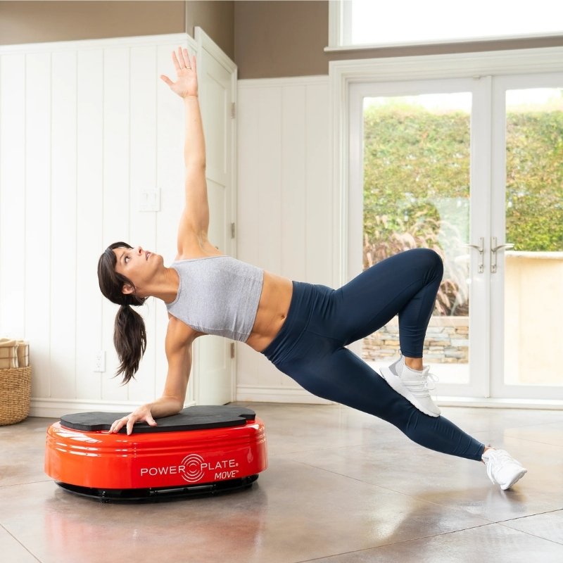 Woman exercising on a Power Plate in a home setting