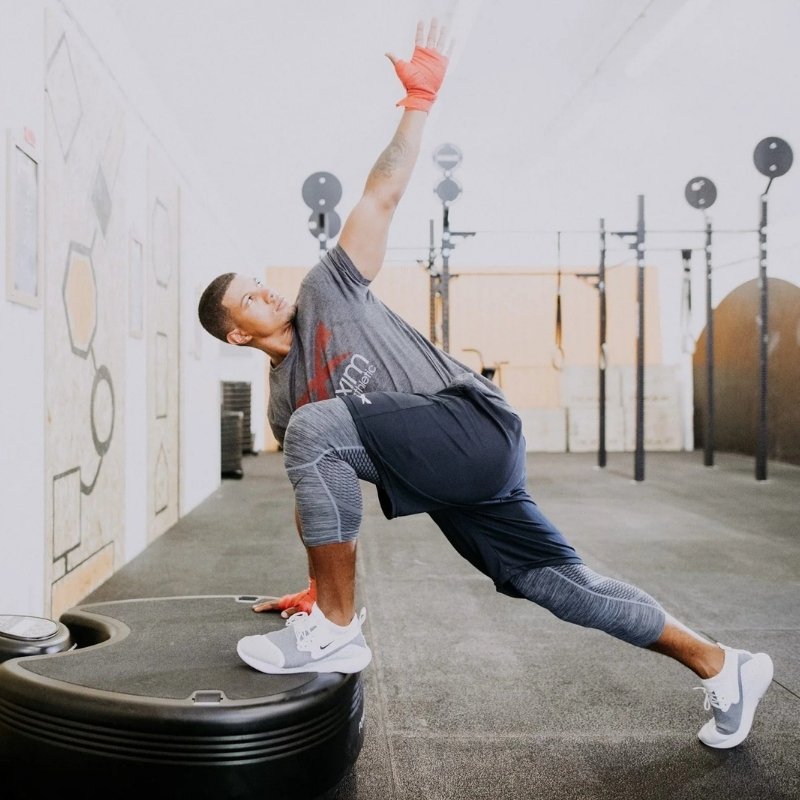 Person exercising on a stability ball in a gym setting